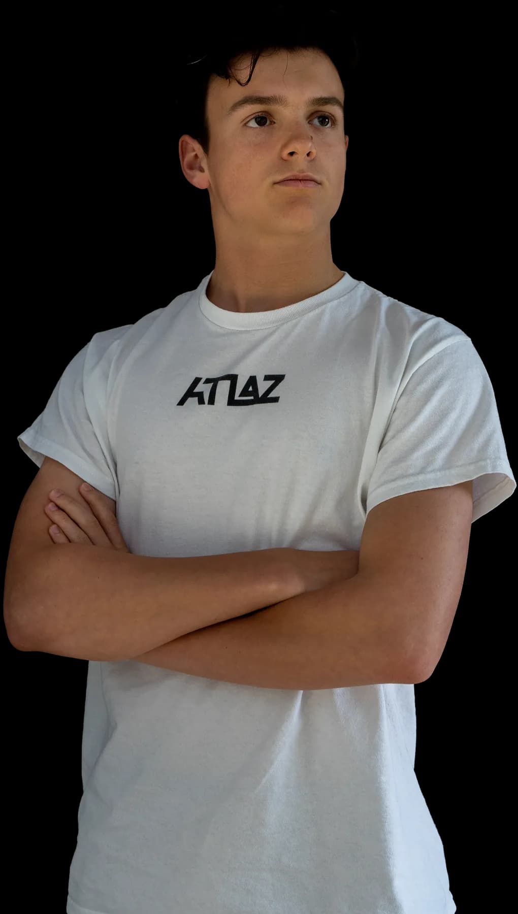 ATLAZ with his arms crossed, wearing an ATLAZ shirt